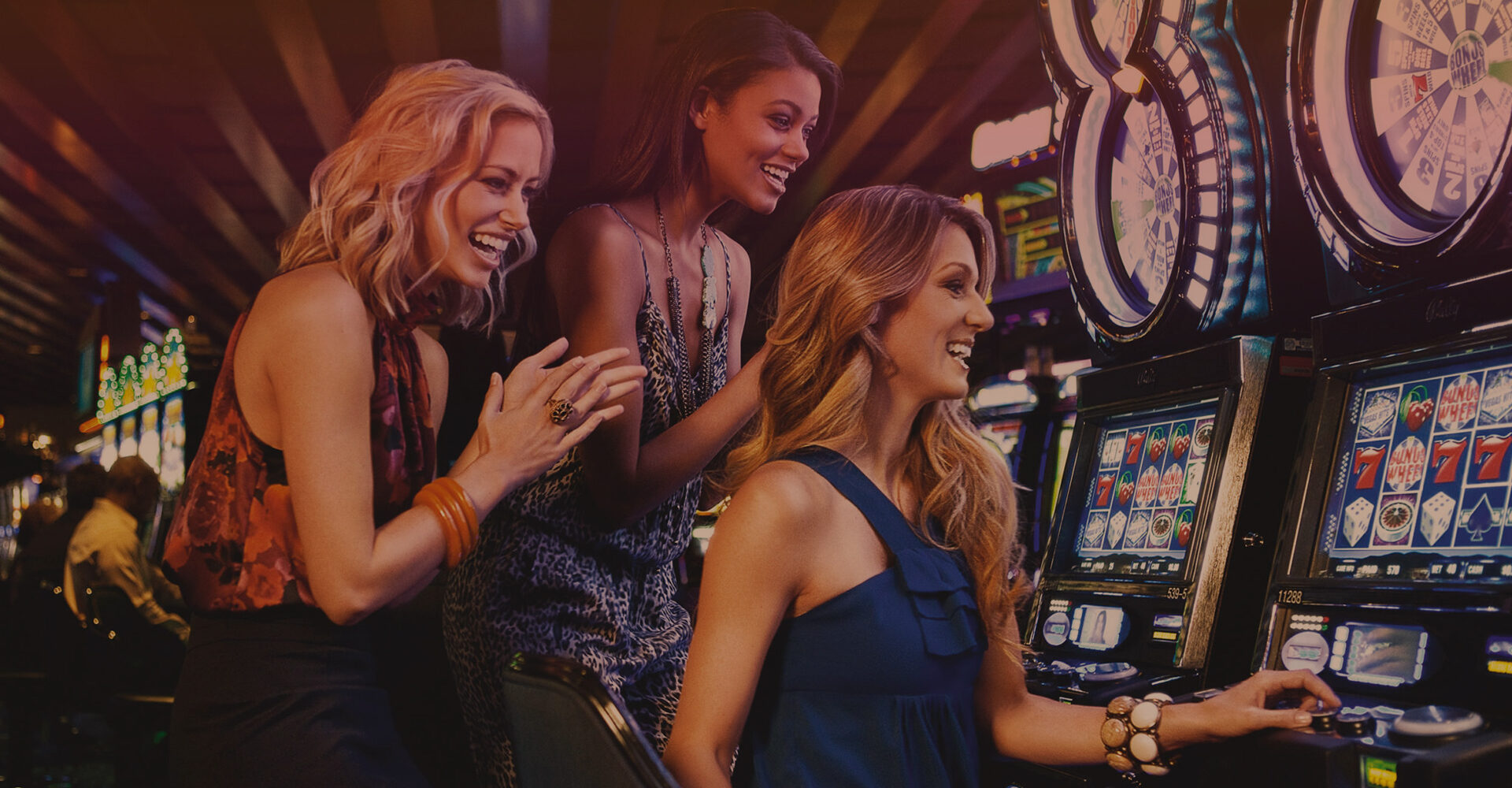 Girls playing slots at a casino