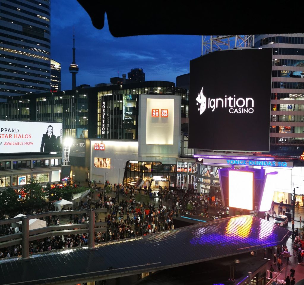 Ignition Casino logo illuminated in Toronto downtown